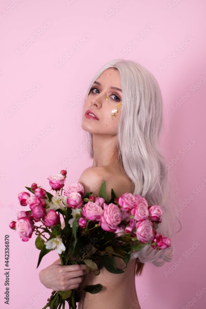blonde girl in white clothes on a pink background