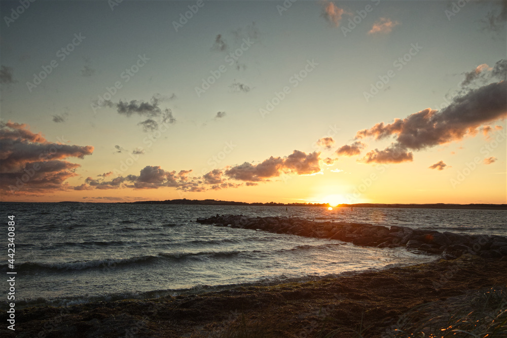 beautiful sunset over the rough sea with dark clouds beautiful sunset over the rough sea with dark clouds