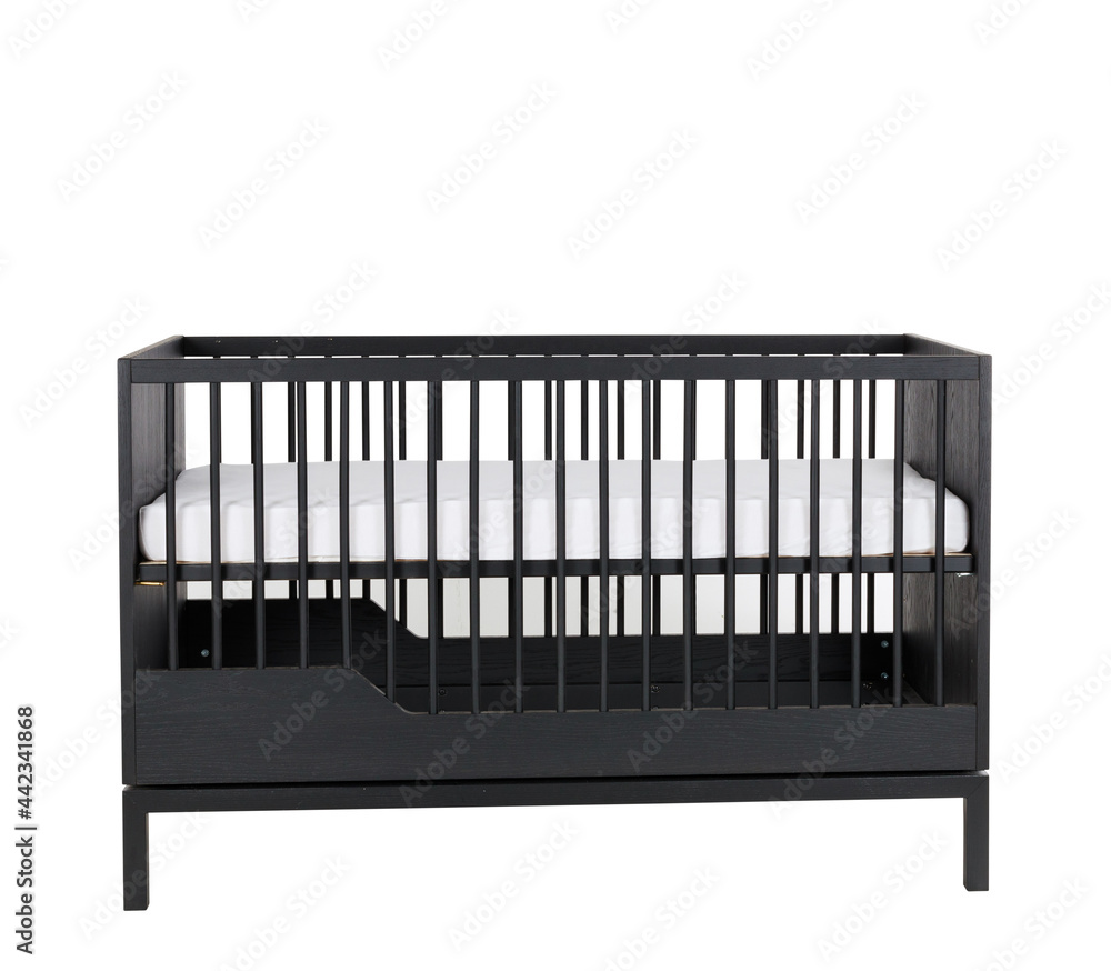 Black wooden baby furniture bed with bars isolated on a white background Black wooden baby furniture bed with bars isolated on a white background