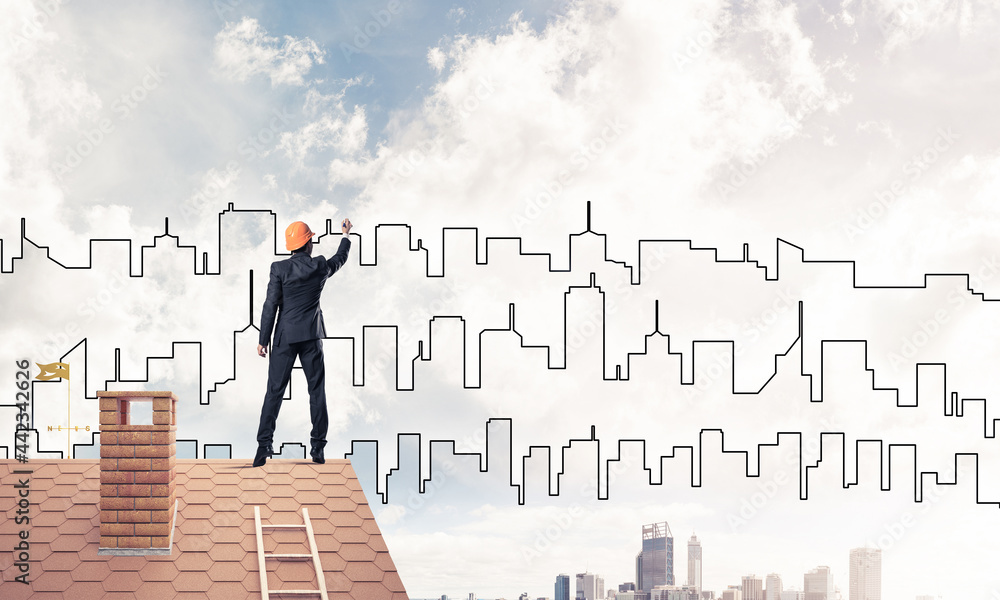 Man architect draw silhouette of modern city on blue sky. Mixed Man architect draw silhouette of modern city on blue sky. Mixed