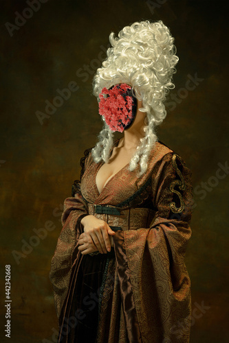 Model like medieval royalty person in vintage clothing. Concept of comparison of eras, artwork, renaissance, baroque style. Creative collage. Surrealism