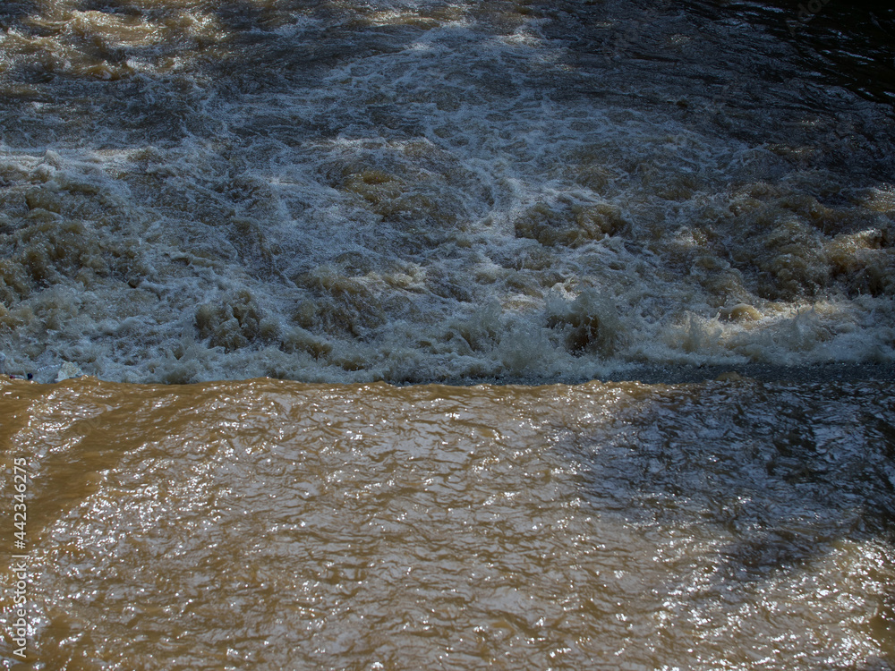 very dirty river flow close-up very dirty river flow close-up