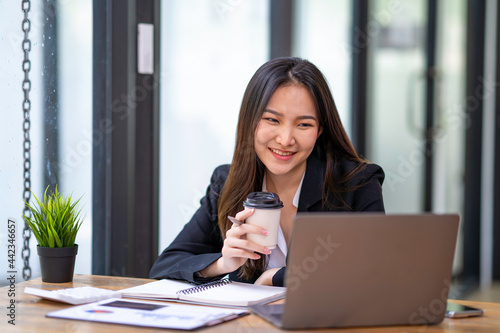 accountant woman happy working in new office, business woman working through laptop