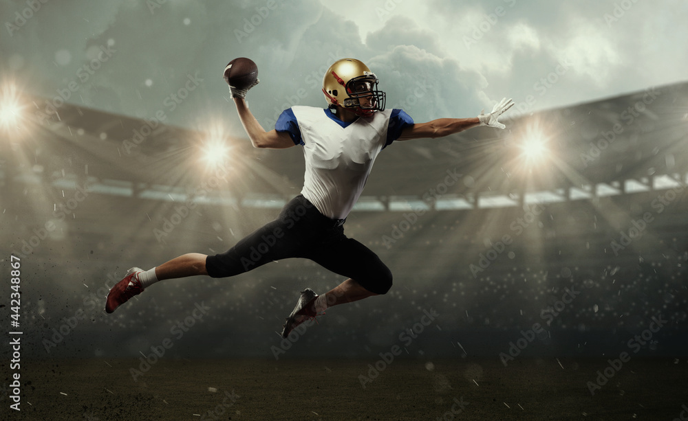 Young man american football player at stadium in motion. Action, activity, sportlife concept. Flyer for ad, design.