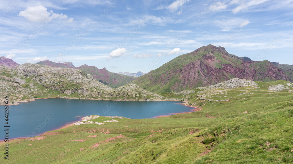 View of the Estanés Reservoir where Hercynian red sandstone meets white limestone on the border of the French and Spanish Pyrenees, Huesca, Aragon