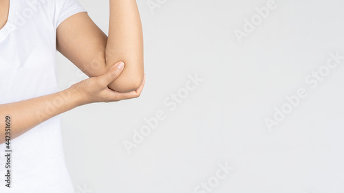 Young woman having body pain on white background, medical health concept.