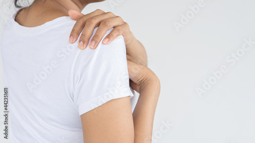 Young woman having body pain on white background  medical health concept.