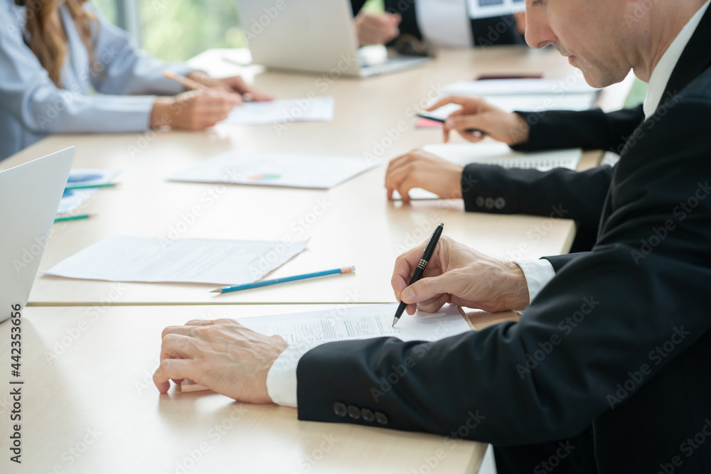 group of business people working and disussing a project together at meeting room group of business people working and disussing a project together at meeting room