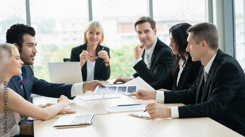 group of business people  working and disussing a project together at meeting room