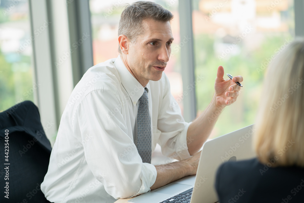 portrait of businessman meeting and discussing with college at meeting room. portrait of businessman meeting and discussing with college at meeting room.
