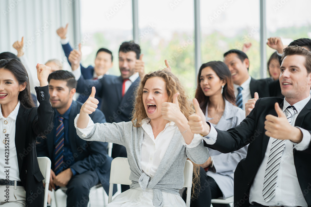 group of business people workshop training in business event at seminar room.business people rasing hands up group of business people workshop training in business event at seminar room.business people rasing hands up