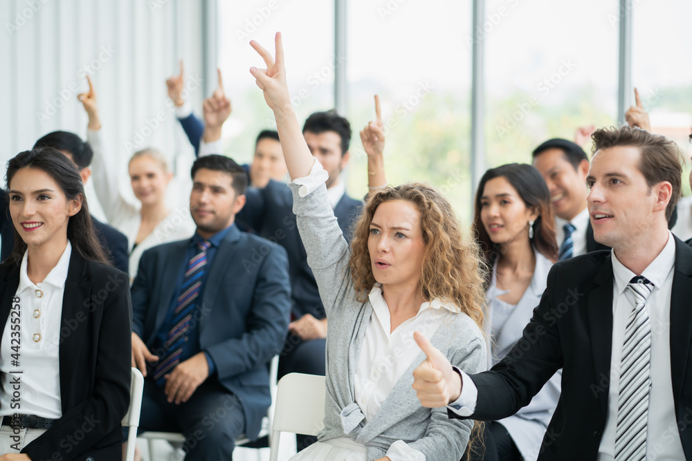 group of business people workshop training in business event at seminar room. business people rasing hands up group of business people workshop training in business event at seminar room. business people rasing hands up