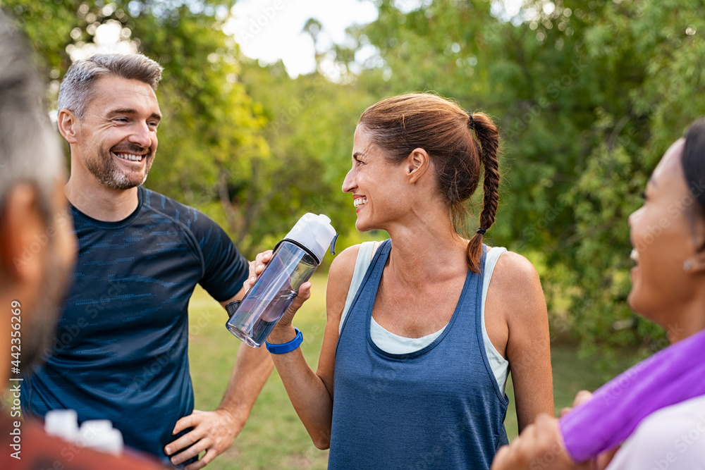 © Rido - Thirsty mature woman drinking water after workout © Rido - Thirsty mature woman drinking water after workout