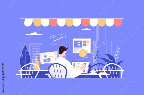 Man working in fashion cafe with tablet
