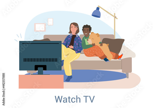 Young friends relaxing together on the sofa watching TV