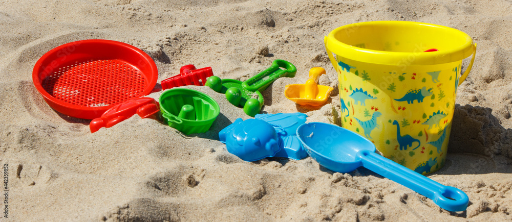 Children toys for relax or playing on sand at beach. Vacation time Children toys for relax or playing on sand at beach. Vacation time