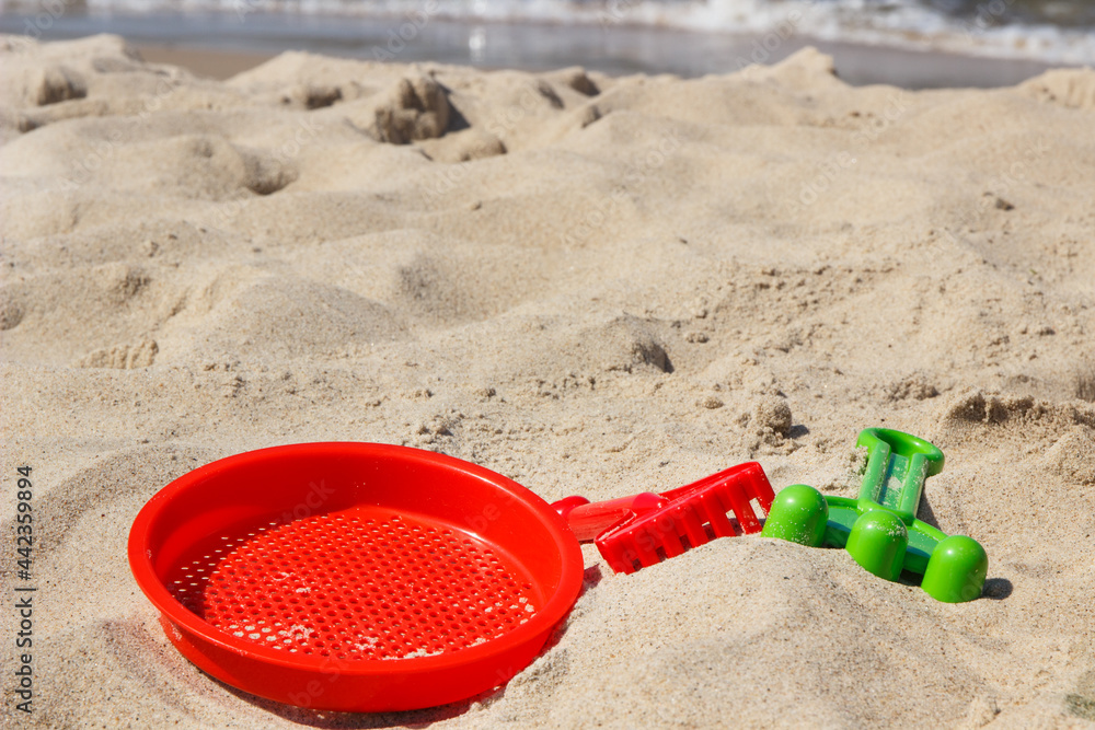 Children toys for relax or playing at beach. Summer, vacation time and child development Children toys for relax or playing at beach. Summer, vacation time and child development