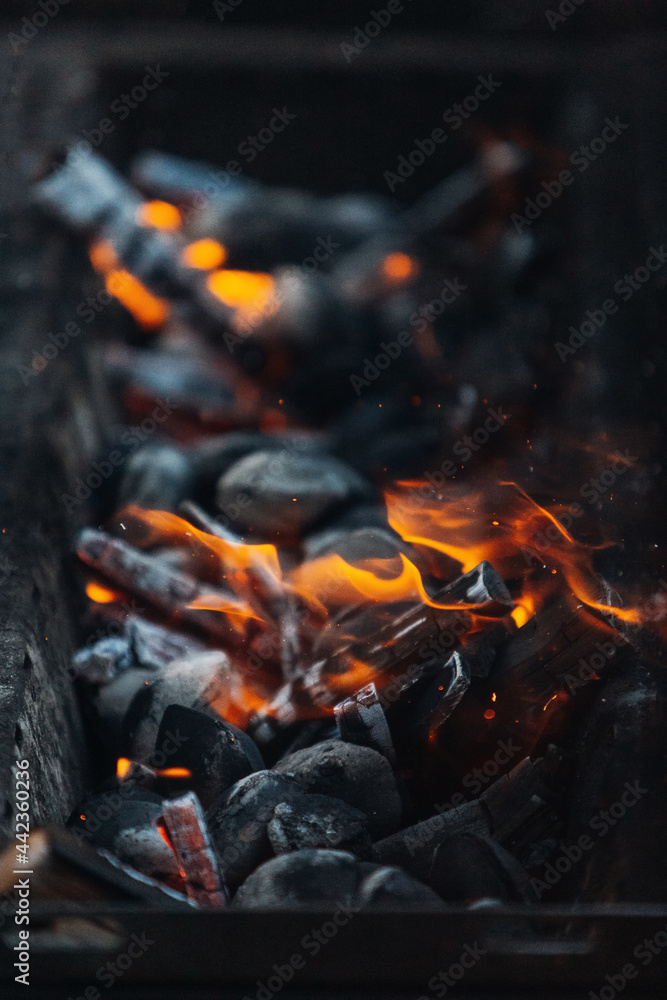 Burning coals in the grill before cooking
Burning coals in the grill before cooking