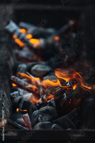 Burning coals in the grill before cooking 