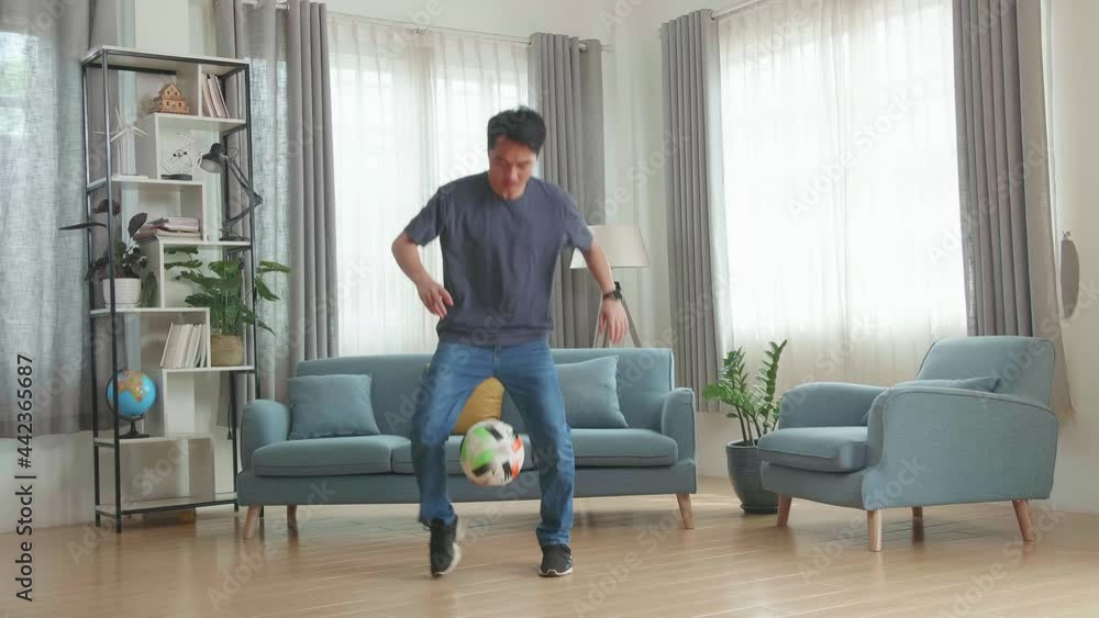 Asian Man Show Skill With Soccer Ball In Living Room, Soccer Freestyle
Asian Man Show Skill With Soccer Ball In Living Room, Soccer Freestyle