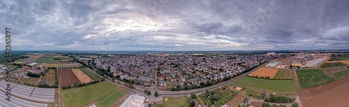 Drone panorama over German municipality Weiterstadt in southern Hesse during sunset