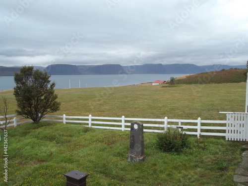 dark clouds over the arna fjord arnafjordur in island photo