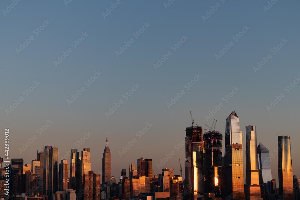 Hudson Yards and Midtown Manhattan Skyline with a Clear Sky during a Sunset in New York City
