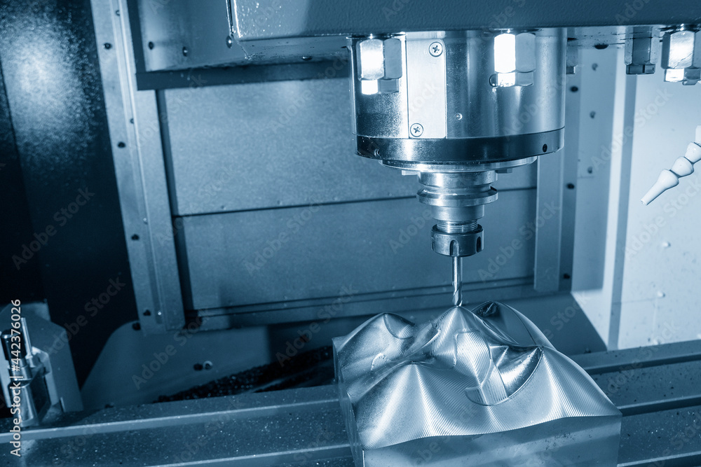 The CNC milling machine cutting the mold parts by solid ball end-mill tool type. The hi-precision mold and die manufacturing concept by machining center. The CNC milling machine cutting the mold parts by solid ball end-mill tool type. The hi-precision mold and die manufacturing concept by machining center.