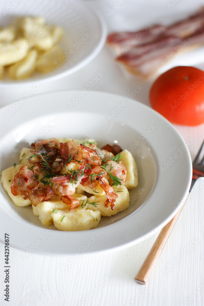 Delicious and tender lazy dumplings with bacon. Unsweetened lazy dumplings. Delicious and tender lazy dumplings with bacon. Unsweetened lazy dumplings.