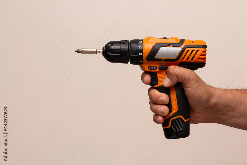 hand holding a drill