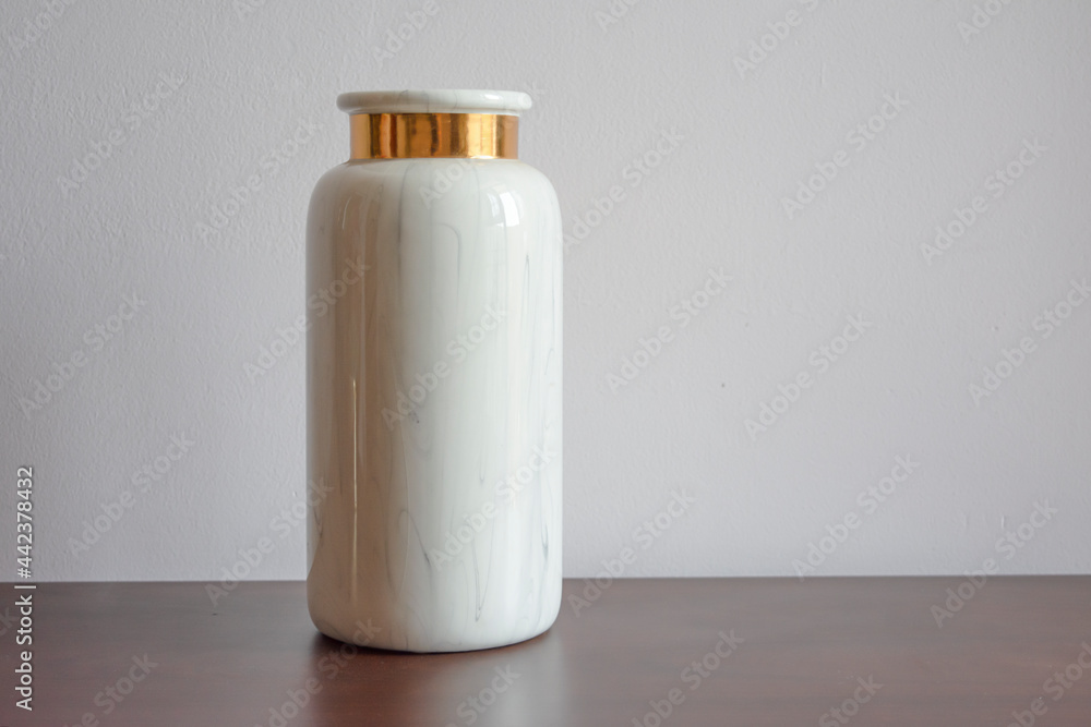 White marble flower vase with golden accent White marble flower vase with golden accent