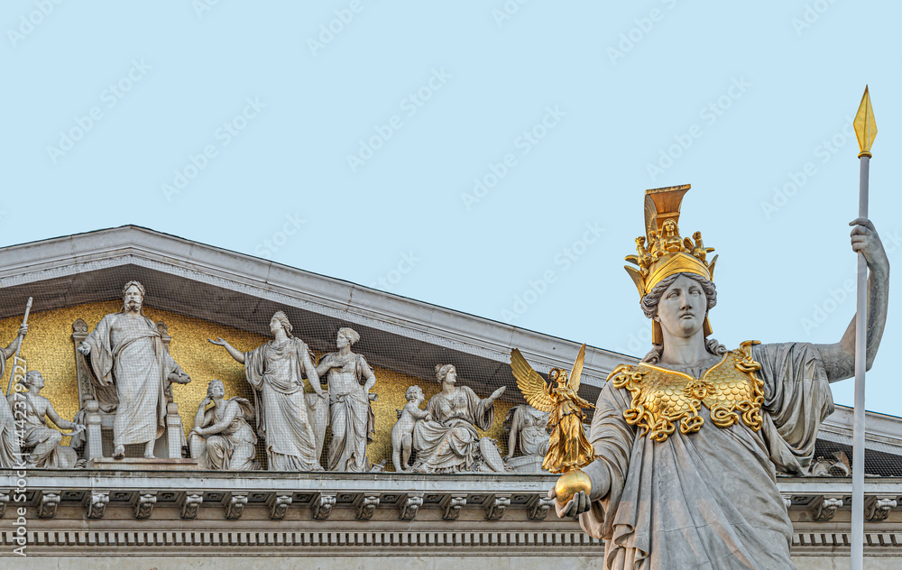 Obraz premium Athena statue at fountain (Pallas-Athene-Brunnen) in front of the Parliament, an ancient Greek goddess for victory and warfare at blue sky in Vienna, Austria, details, closeup.