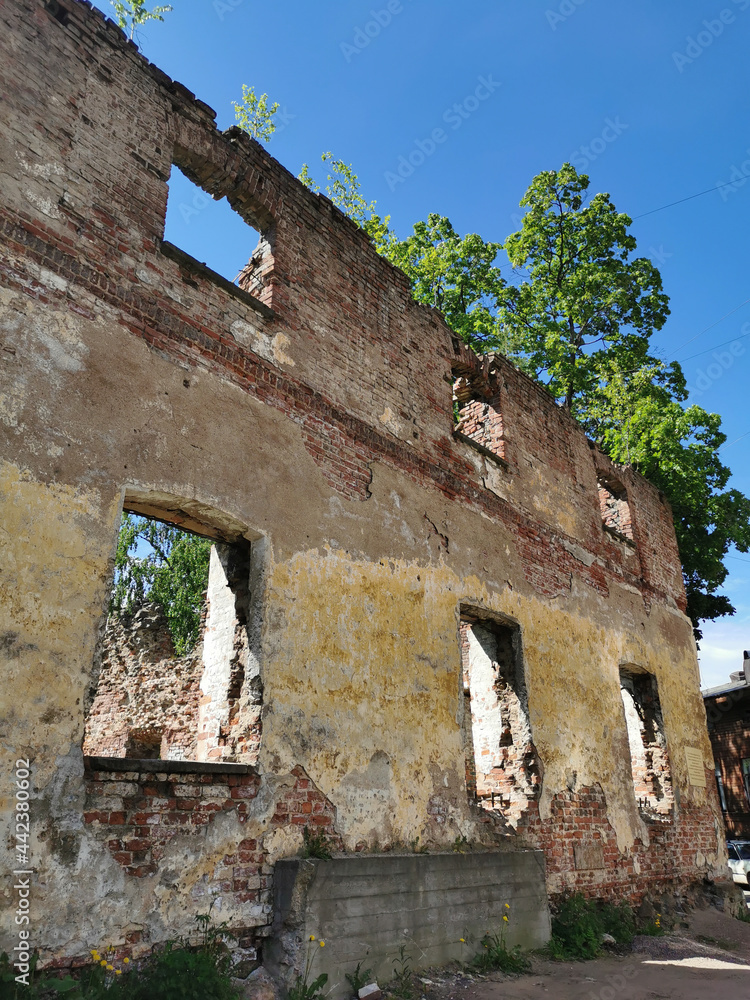 The destroyed walls of the Vyborg Cathedral in the city of Vyborg against the blue sky. The destroyed walls of the Vyborg Cathedral in the city of Vyborg against the blue sky.