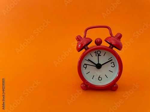 alarm clock isolated on colored background