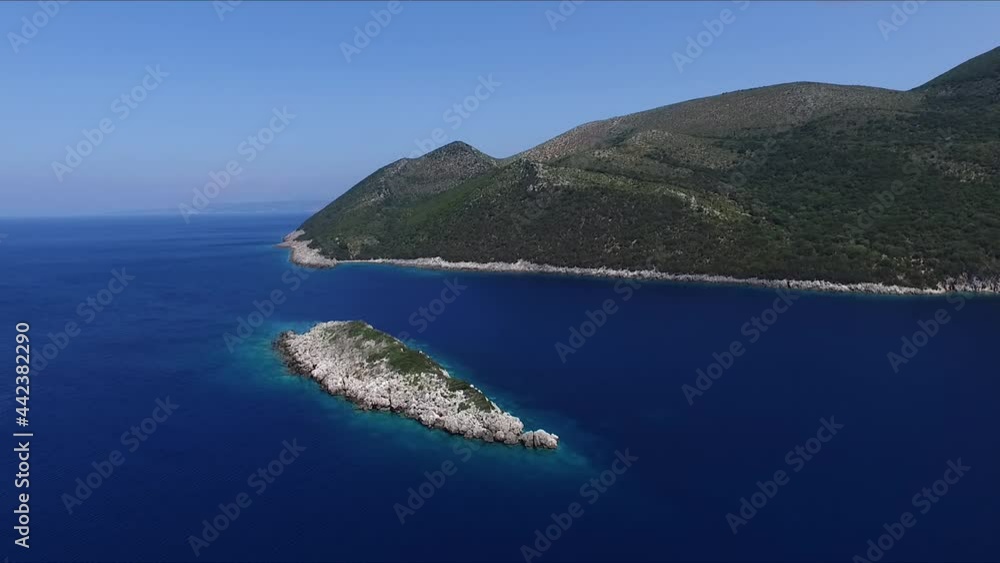 Aerial view of a small island in the middle of the crystal clear waters of the Mediterranean Sea Aerial view of a small island in the middle of the crystal clear waters of the Mediterranean Sea
