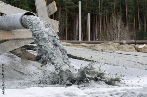discharge of fine sand into the tailing dump