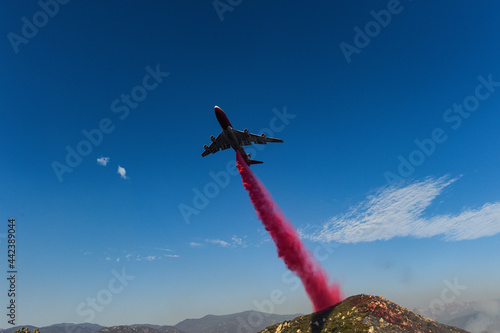 Aircraft dropping phoscheck fire retardant