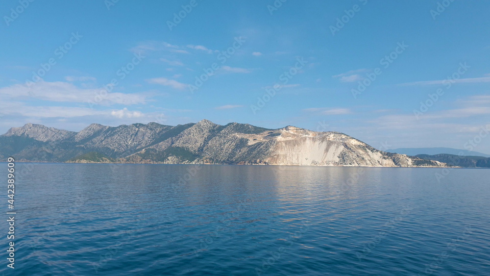 View of the mountains of an Aegean Island in Greece. Shooting from water.