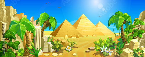 Egyptian pyramids among the sands. Desert landscape with palm trees and tropical plants.