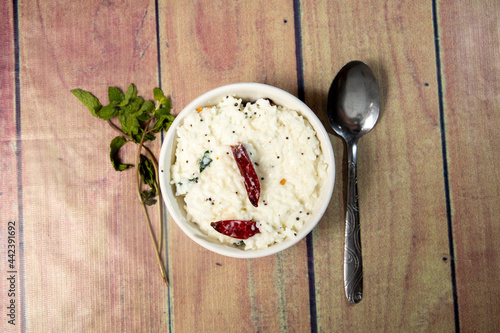 South indian meal of curd rice on a white bowl