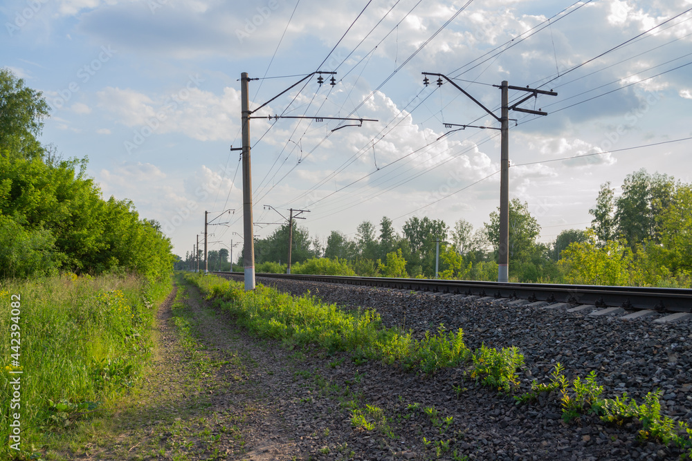 Russian railway. Green forest with blue sky and clouds. Russian railway. Green forest with blue sky and clouds.