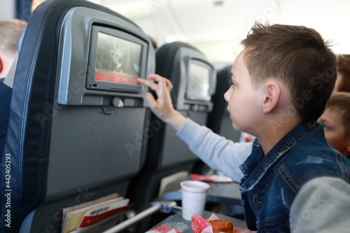 Child turns on multimedia system on board aircraft