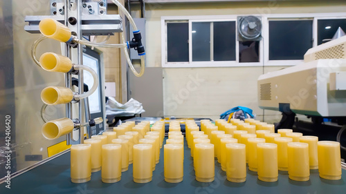 Golden Plastic injection molding  in the production line. photo