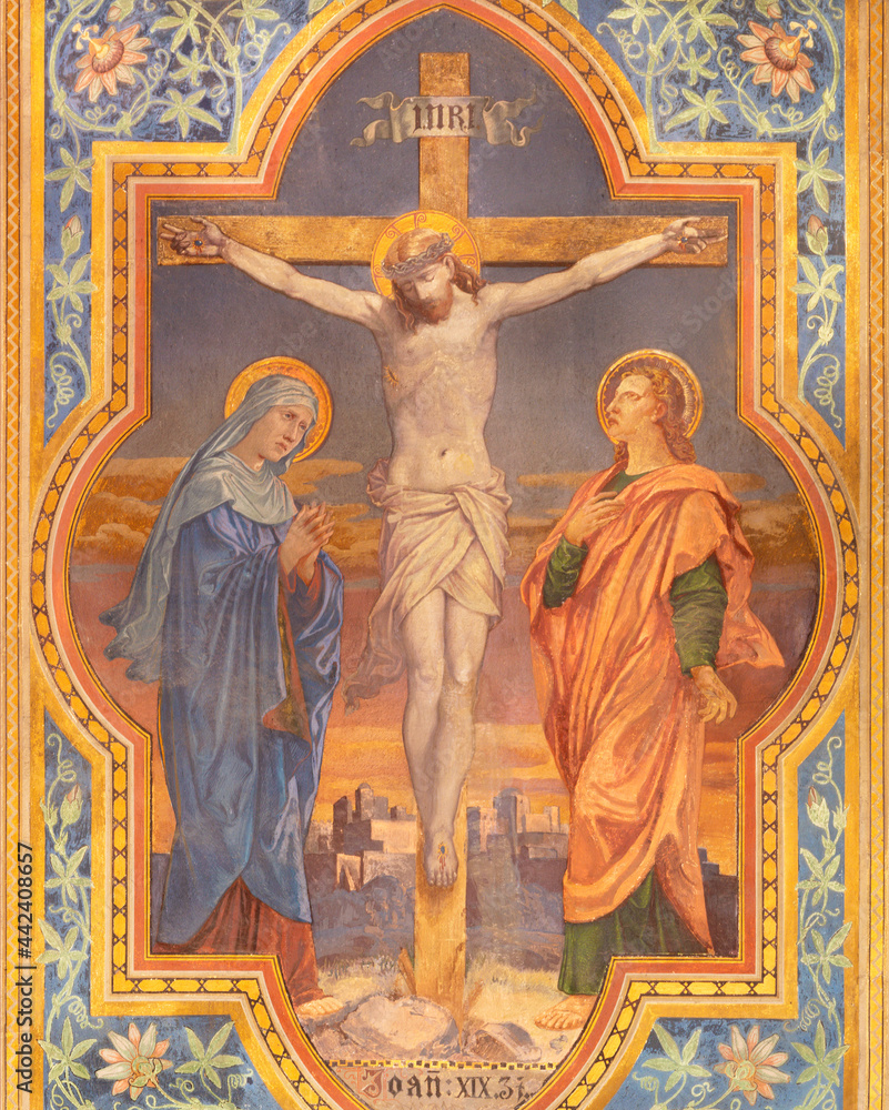 VIENNA, AUSTIRA - JUNI 24, 2021: The fresco of Crucifixion in the Votivkirche church by brothers Carl and Franz Jobst (sc. half of 19. cent.).
