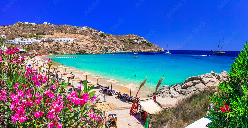 Greece summer vacation. Luxury greek holidays. Stunning Mykonos island. famous Super Paradise beach with  turquoise sea