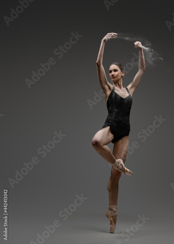 Young artistic ballerina and her professional perfomance