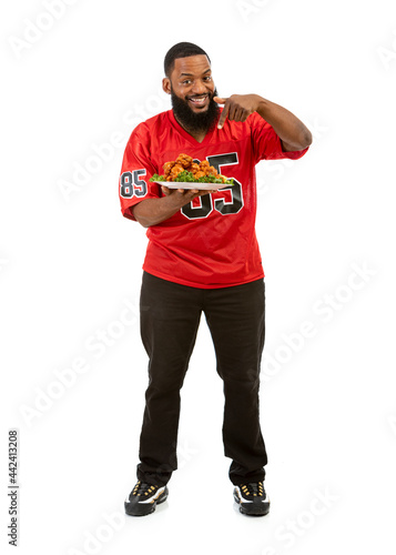 Fan: Sports Man Points To Platter Of Chicken Wings © seanlockephotography
