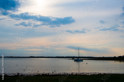 A Catamaran in an estuary at sunset
