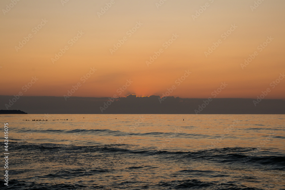 beautiful sunset on the sea. beach and surf at sunset. beautiful sunset on the sea. beach and surf at sunset.