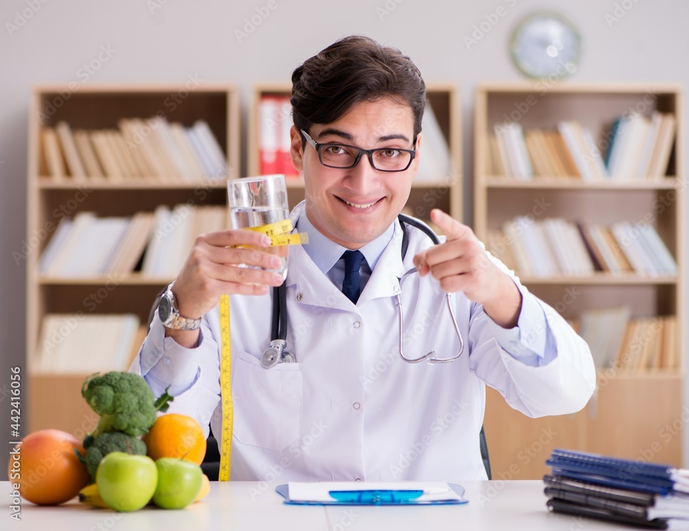 Doctor in dieting concept with fruits and vegetables Doctor in dieting concept with fruits and vegetables